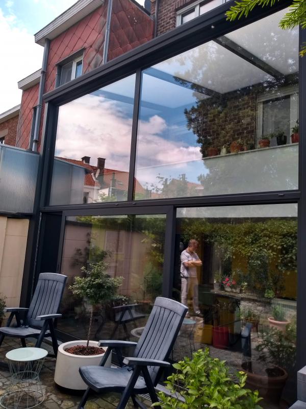 Veranda 2 verdiepingen polycarbonaat zonwerend glas schuifraam monorail Reynaers